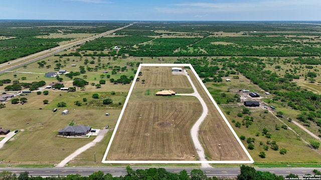 birds eye view of property featuring a rural view