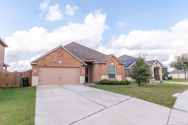 view of front facade featuring a front yard and a garage