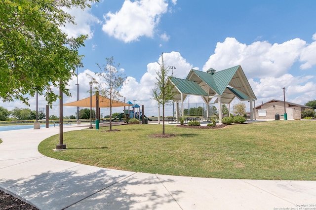 surrounding community with a playground and a lawn