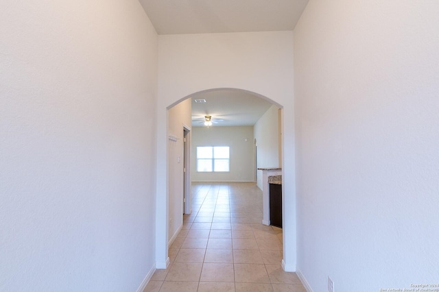 hallway featuring light tile patterned floors