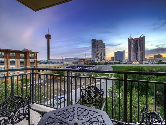 view of balcony at dusk