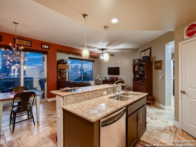 215 Center St Unit 307, San Antonio, TX 78202 - kitchen featuring dishwasher, stone tile floors, open floor plan, a sink, and ceiling fan