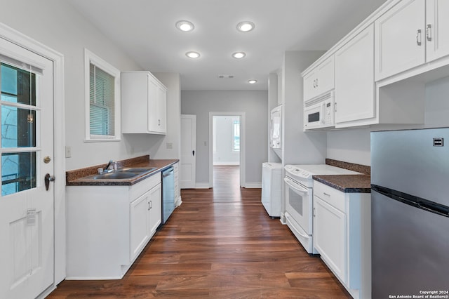 kitchen featuring sink, dark hardwood / wood-style flooring, white cabinets, and appliances with stainless steel finishes