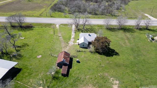 birds eye view of property with a rural view