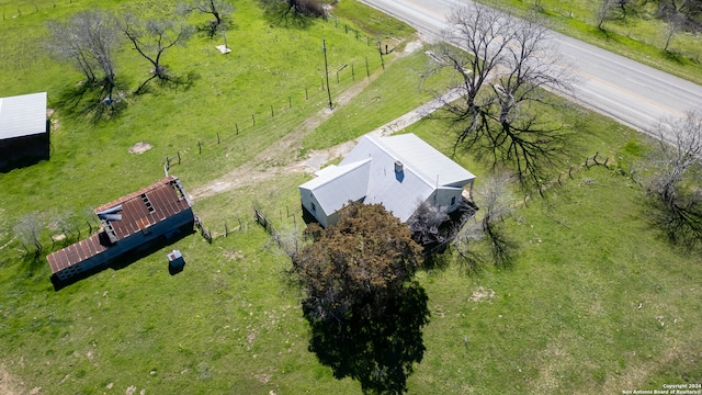 birds eye view of property with a rural view