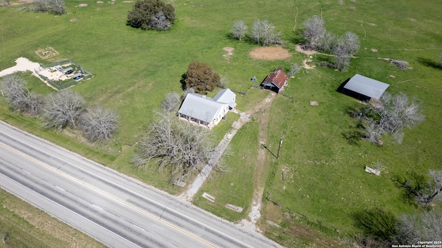 birds eye view of property with a rural view