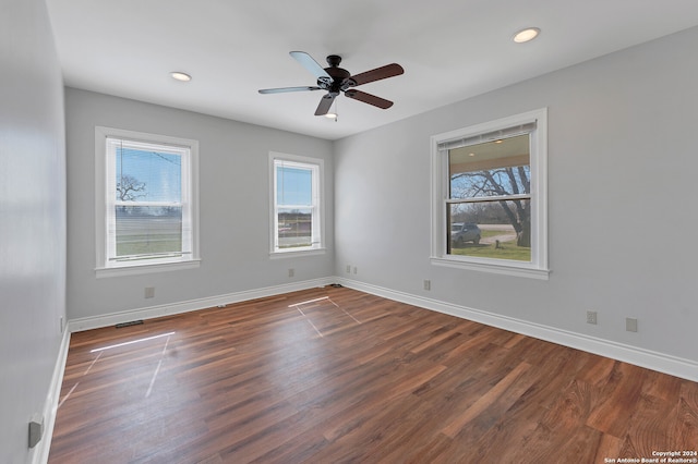 spare room with ceiling fan and hardwood / wood-style floors