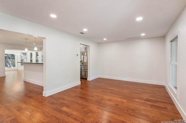 spare room featuring dark hardwood / wood-style floors