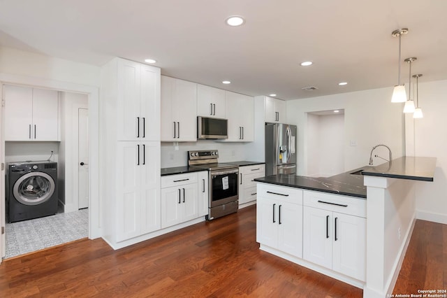 kitchen with white cabinetry, sink, stainless steel appliances, kitchen peninsula, and washer / dryer