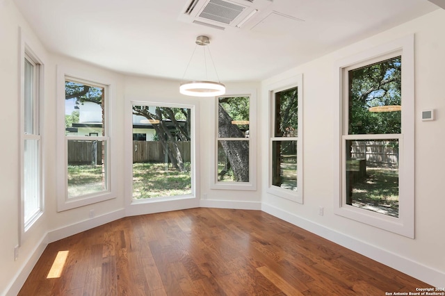 unfurnished sunroom with a wealth of natural light