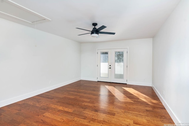 spare room with french doors, dark hardwood / wood-style floors, and ceiling fan