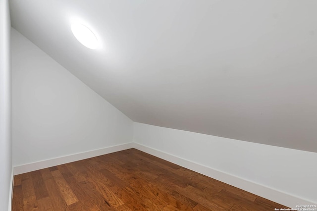 bonus room featuring hardwood / wood-style floors and vaulted ceiling