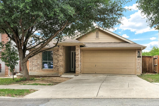 ranch-style home featuring a garage