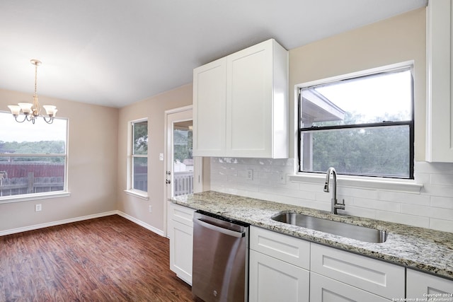 kitchen with dishwasher, sink, hanging light fixtures, backsplash, and white cabinets