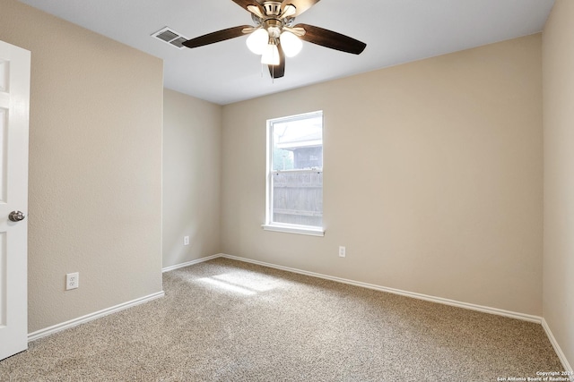 empty room featuring carpet flooring and ceiling fan