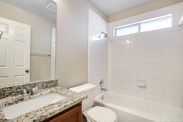 full bathroom with vanity, bathing tub / shower combination, and toilet