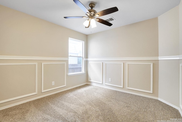 unfurnished room featuring carpet flooring and ceiling fan