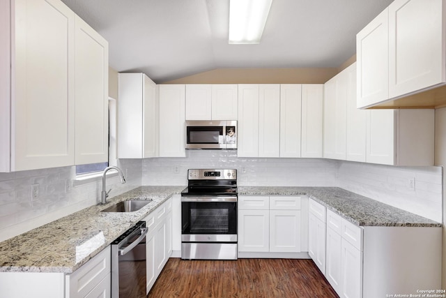 kitchen featuring white cabinets, sink, decorative backsplash, dark hardwood / wood-style floors, and appliances with stainless steel finishes