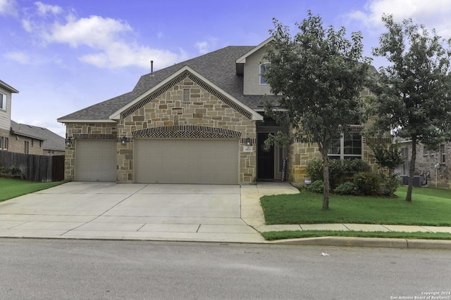 view of front facade featuring a garage and a front yard