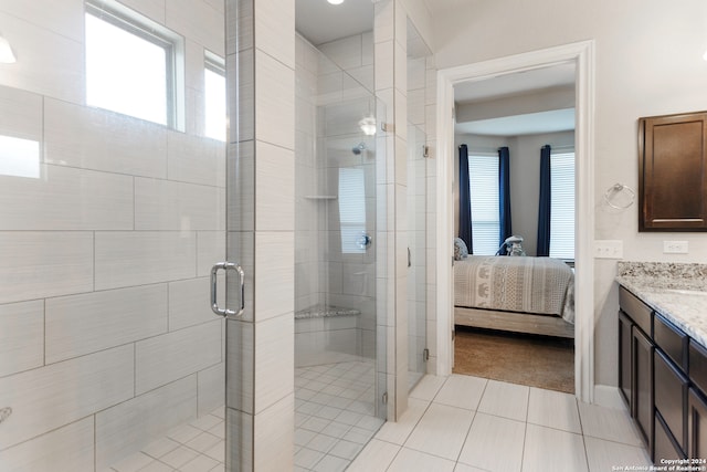 bathroom with vanity, tile patterned floors, plenty of natural light, and an enclosed shower