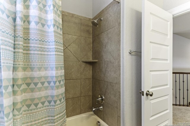 bathroom featuring shower / tub combo with curtain