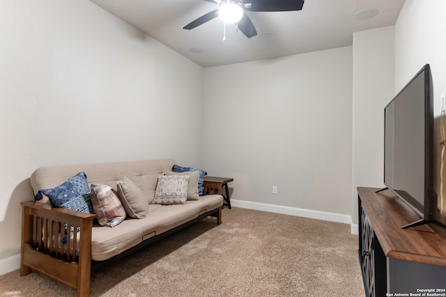 living area featuring ceiling fan and light carpet