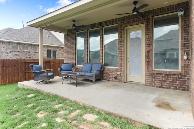 view of patio featuring an outdoor living space and ceiling fan