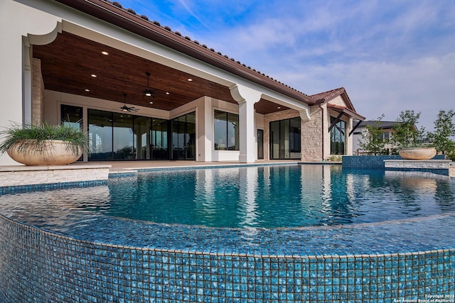 view of pool with ceiling fan