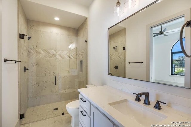 bathroom featuring tasteful backsplash, walk in shower, vanity, ceiling fan, and toilet