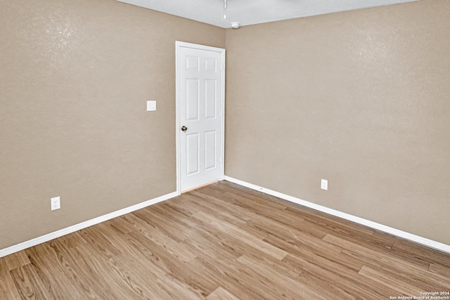 spare room featuring hardwood / wood-style flooring