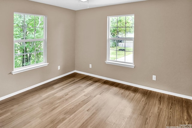 unfurnished room featuring light hardwood / wood-style floors