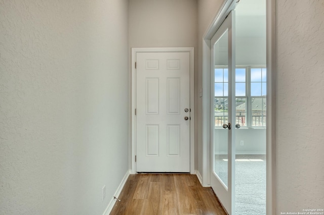 entryway with light hardwood / wood-style floors