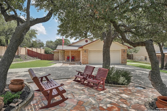 view of patio featuring a garage