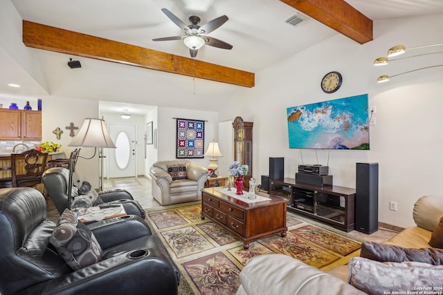 living room featuring ceiling fan and lofted ceiling with beams