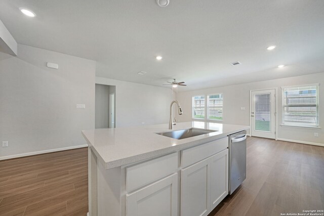 kitchen with white cabinetry, sink, a kitchen island with sink, ceiling fan, and stainless steel dishwasher