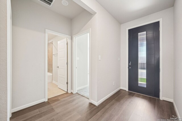 foyer entrance with hardwood / wood-style floors