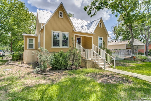 bungalow-style home featuring a front yard