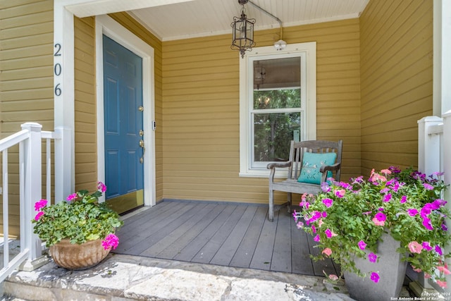 entrance to property featuring a porch