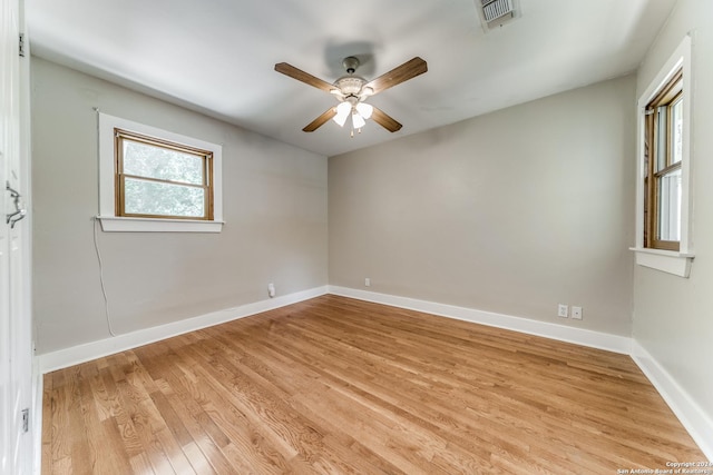 unfurnished room featuring ceiling fan and light wood-type flooring