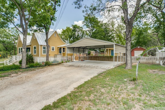 view of parking / parking lot with a lawn and a carport