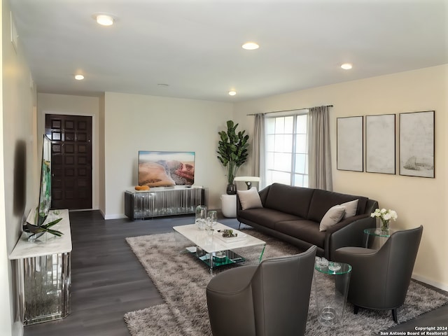 living area with recessed lighting, dark wood-style floors, and baseboards