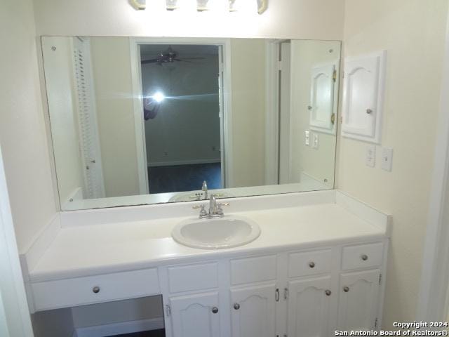 bathroom featuring vanity and ceiling fan