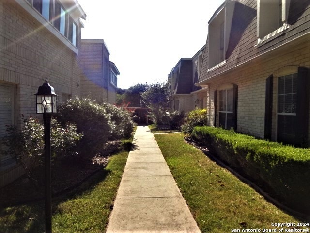 view of community featuring a lawn