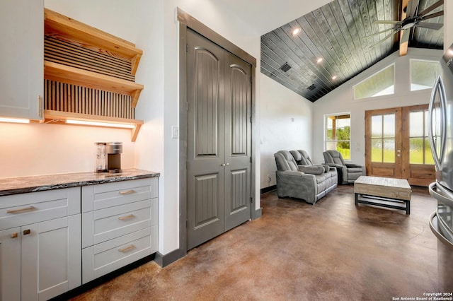 living room featuring high vaulted ceiling, wooden ceiling, ceiling fan, and beam ceiling