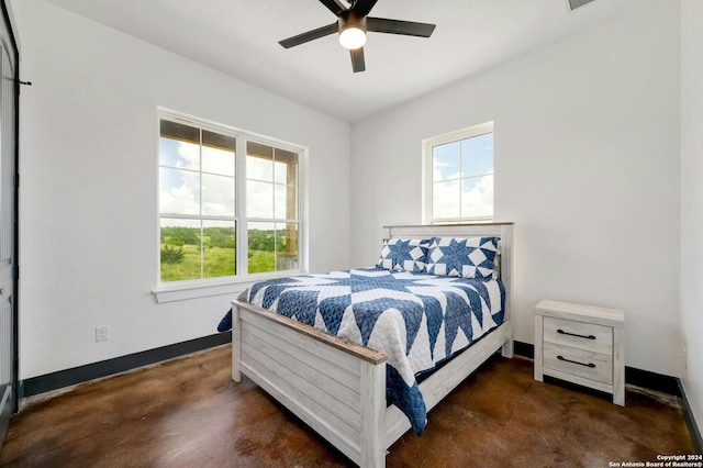 bedroom featuring multiple windows and ceiling fan