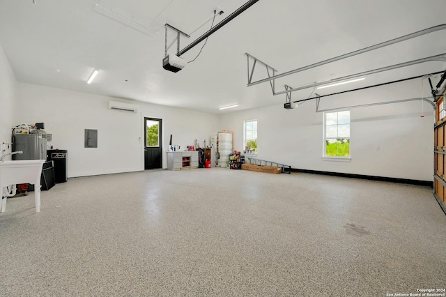 garage with a wall mounted air conditioner, a garage door opener, fridge, and electric panel