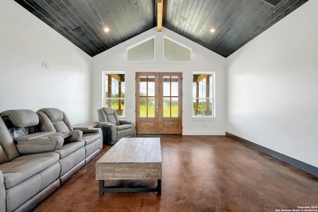 unfurnished living room featuring wood ceiling, high vaulted ceiling, beamed ceiling, and french doors