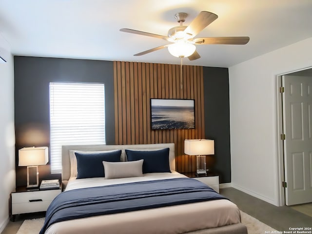 bedroom with multiple windows and ceiling fan