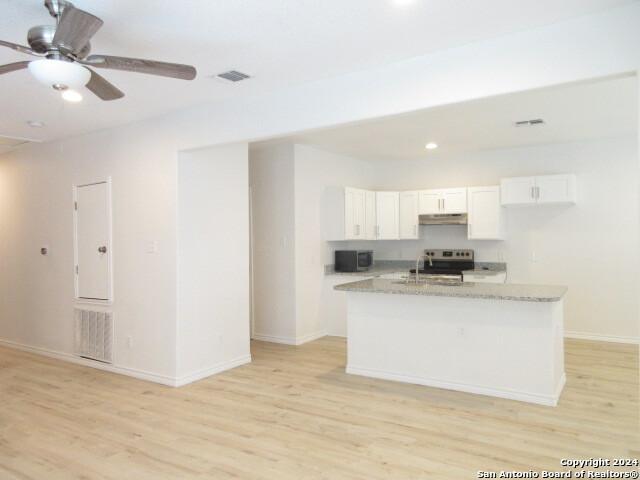 full bathroom featuring toilet, tiled shower / bath, vanity, and hardwood / wood-style flooring