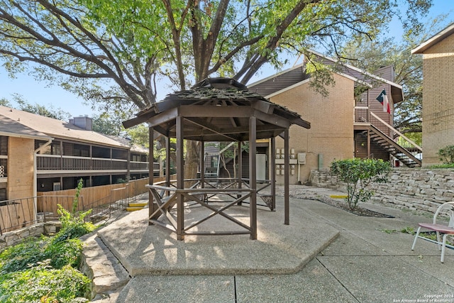 8655 Datapoint Dr Unit 212, San Antonio, TX 78229 - view of patio with a gazebo, stairs, and fence